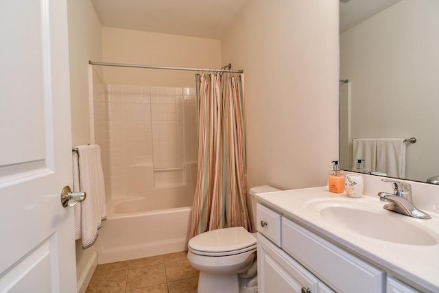 bathroom with vanity, toilet, shower / bath combo with shower curtain, and tile patterned flooring