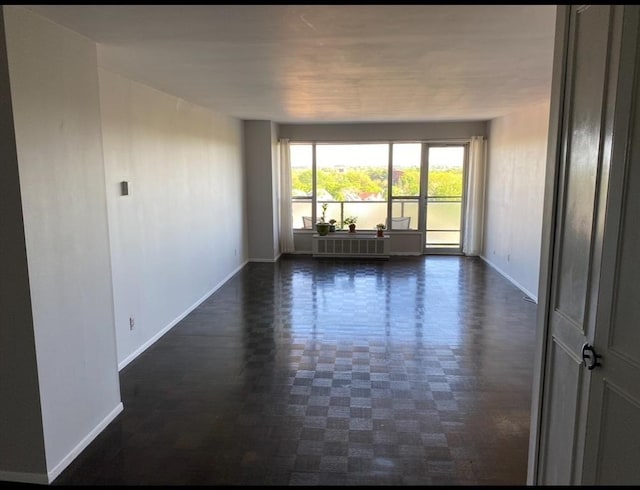 111 Perkins St Unit 108, Boston, MA 02130 - unfurnished room featuring baseboards and radiator