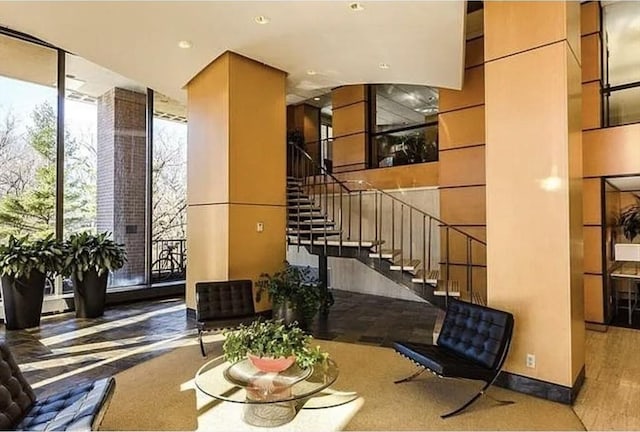 111 Perkins St Unit 108, Boston, MA 02130 - common area with stairway, recessed lighting, and floor to ceiling windows