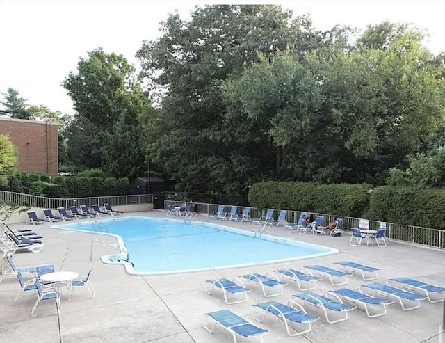 111 Perkins St Unit 108, Boston, MA 02130 - community pool with a patio area and view of wooded area