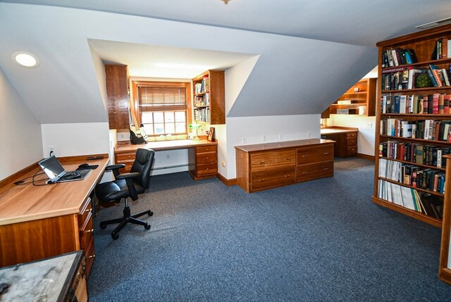 office area featuring carpet flooring, a baseboard radiator, and vaulted ceiling