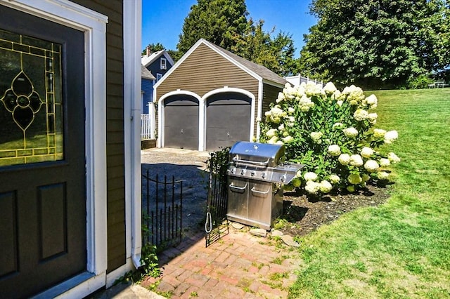 view of yard with driveway and a garage