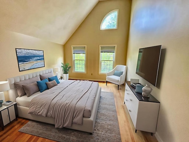 35 Mitchell Grant Way, Bedford, MA 01730 - bedroom with light wood-style floors, high vaulted ceiling, and multiple windows