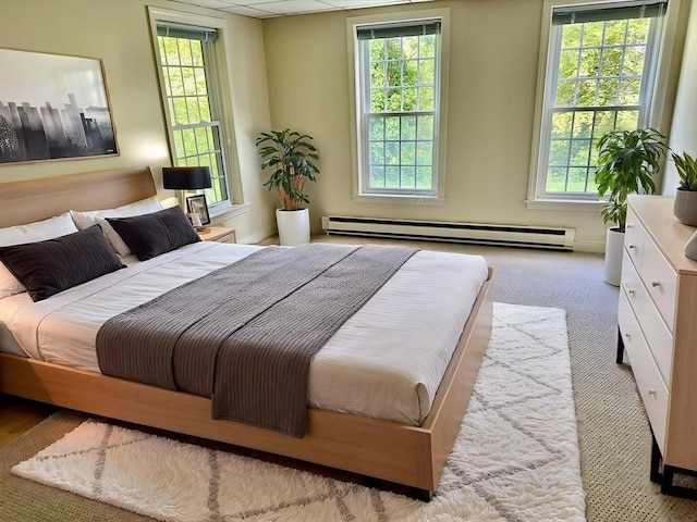 35 Mitchell Grant Way, Bedford, MA 01730 - bedroom with a baseboard heating unit and multiple windows