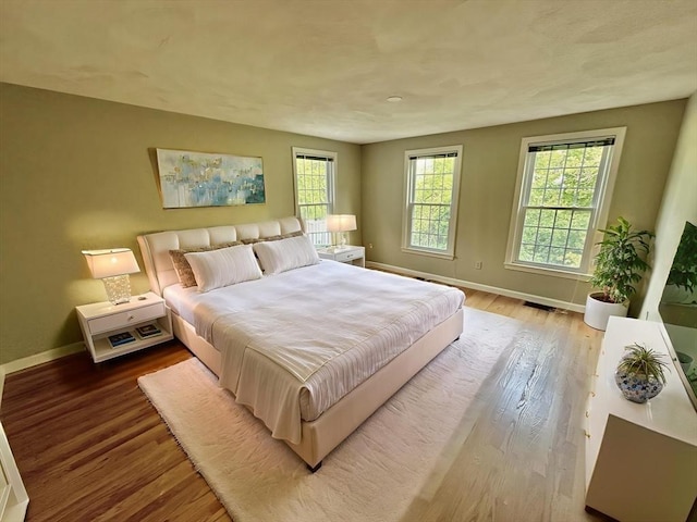 35 Mitchell Grant Way, Bedford, MA 01730 - bedroom featuring baseboards and wood finished floors