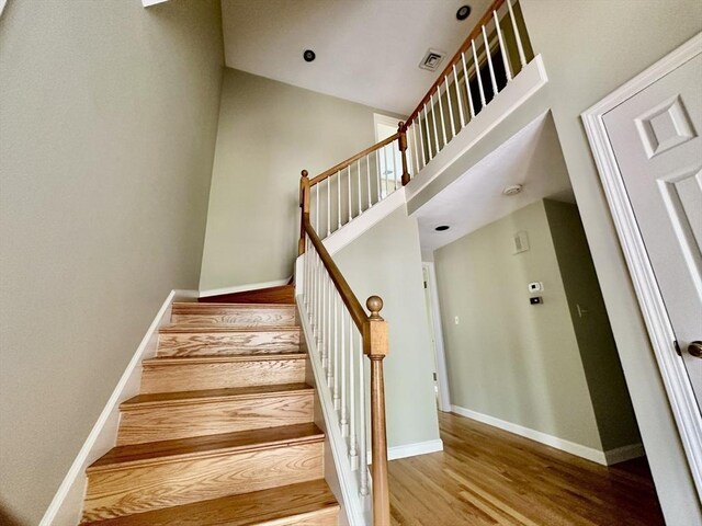 35 Mitchell Grant Way, Bedford, MA 01730 - staircase with wood finished floors and baseboards