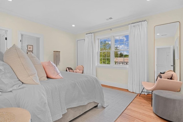 382 Lee St, Brookline, MA 02445 - bedroom featuring wood finished floors, crown molding, baseboards, and recessed lighting