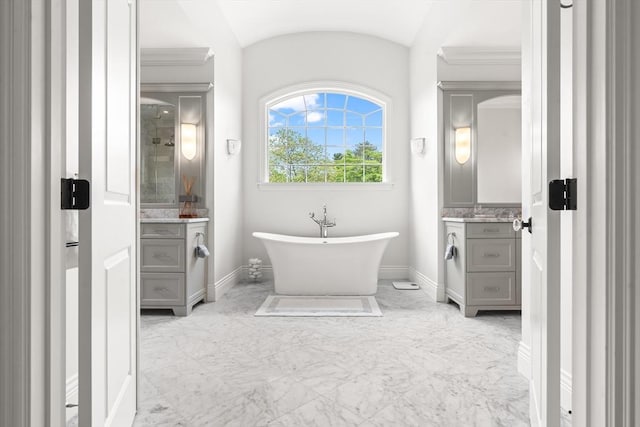 382 Lee St, Brookline, MA 02445 - full bath featuring vanity, baseboards, a freestanding tub, marble finish flooring, and a shower