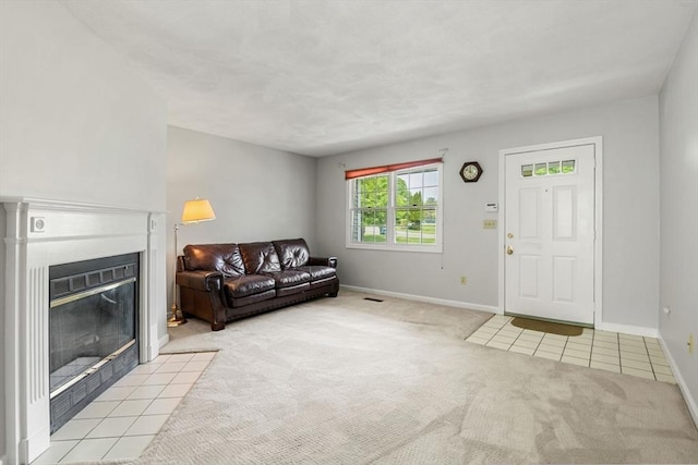 20 Ipswich Woods Dr Unit 20, Ipswich, MA 01938 - tiled living area with carpet floors, baseboards, and a fireplace with flush hearth