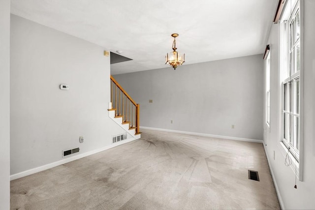 20 Ipswich Woods Dr Unit 20, Ipswich, MA 01938 - carpeted spare room with stairway, baseboards, and a chandelier