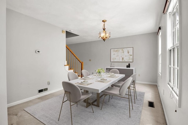 20 Ipswich Woods Dr Unit 20, Ipswich, MA 01938 - dining space featuring stairs, baseboards, light carpet, and a chandelier