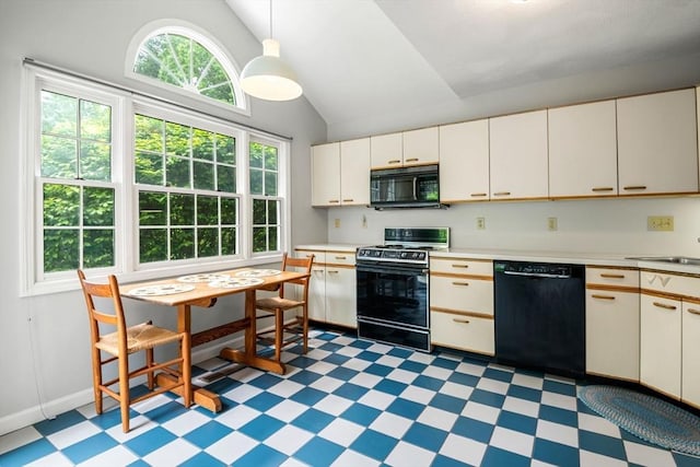 20 Ipswich Woods Dr Unit 20, Ipswich, MA 01938 - kitchen with black appliances, light flooring, lofted ceiling, light countertops, and decorative light fixtures