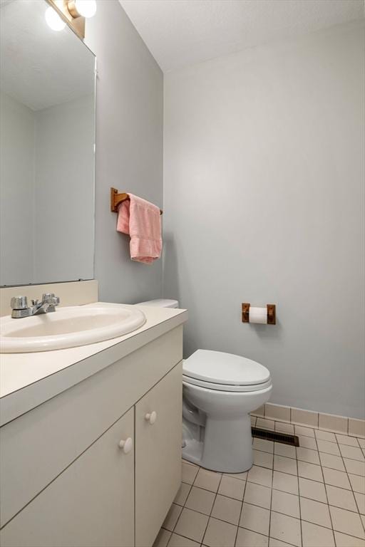 20 Ipswich Woods Dr Unit 20, Ipswich, MA 01938 - half bathroom with vanity, tile patterned flooring, toilet, and baseboards