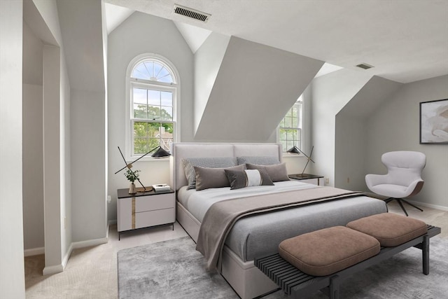 20 Ipswich Woods Dr Unit 20, Ipswich, MA 01938 - bedroom with vaulted ceiling, light carpet, multiple windows, and baseboards