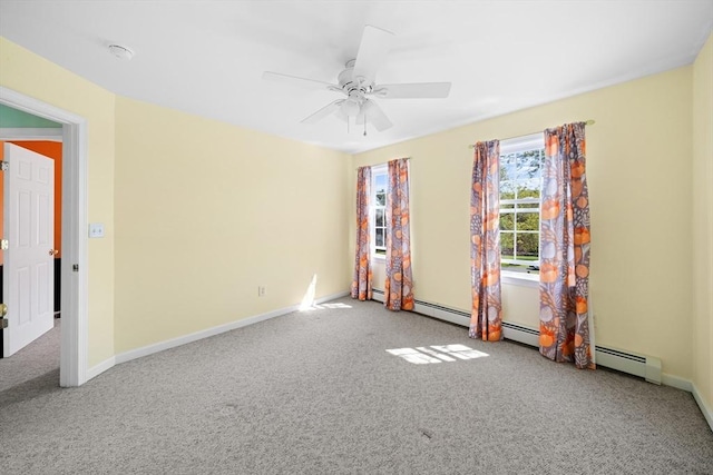 unfurnished room featuring carpet flooring, ceiling fan, and baseboards