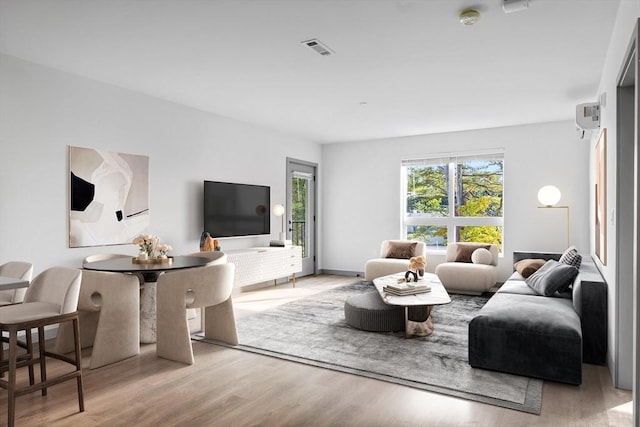 living room with light hardwood / wood-style flooring