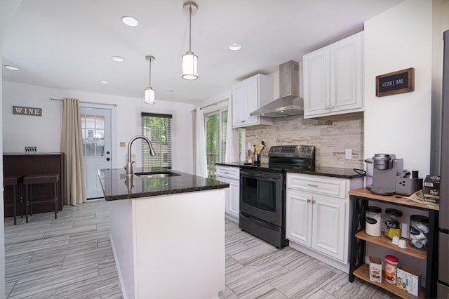 362 Commercial St, Braintree, MA 02184 - kitchen with black electric range, wall chimney exhaust hood, a sink, white cabinetry, and backsplash