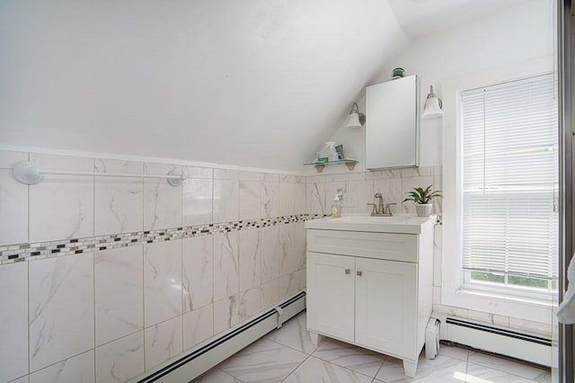 362 Commercial St, Braintree, MA 02184 - bathroom featuring a baseboard heating unit, lofted ceiling, vanity, marble finish floors, and tile walls
