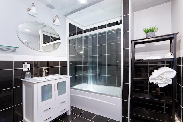 362 Commercial St, Braintree, MA 02184 - full bath with vanity, tile walls, tile patterned flooring, and bath / shower combo with glass door