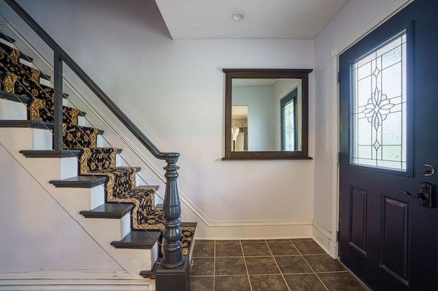 362 Commercial St, Braintree, MA 02184 - entrance foyer with stairway, dark tile patterned flooring, and baseboards