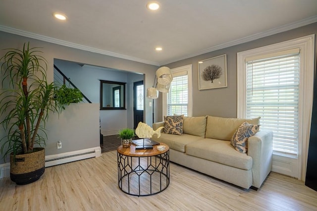 362 Commercial St, Braintree, MA 02184 - living area featuring a baseboard heating unit, wood finished floors, plenty of natural light, ornamental molding, and baseboards