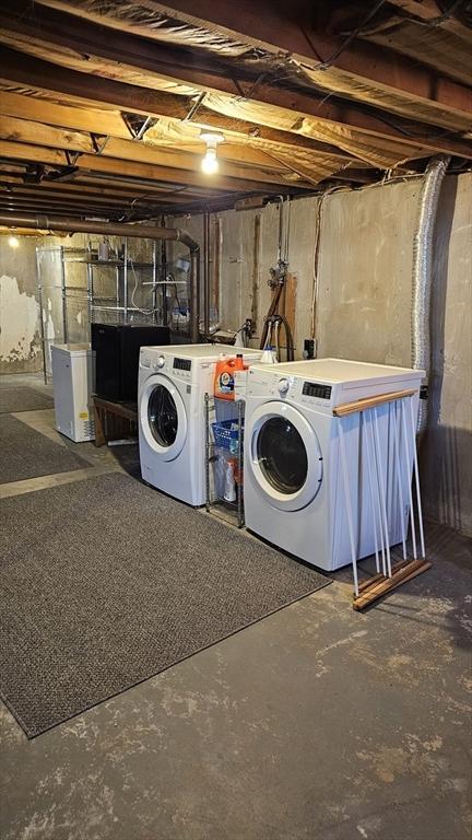 laundry area with separate washer and dryer and laundry area