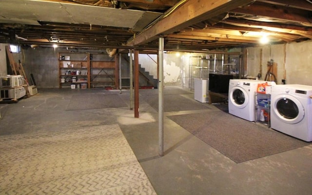 unfinished below grade area featuring stairway and washing machine and dryer