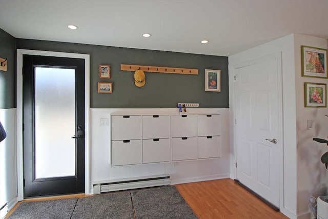 entryway featuring light wood-style flooring, recessed lighting, and baseboard heating