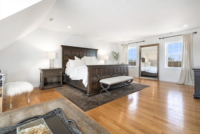 bedroom featuring visible vents, recessed lighting, wood finished floors, and baseboards