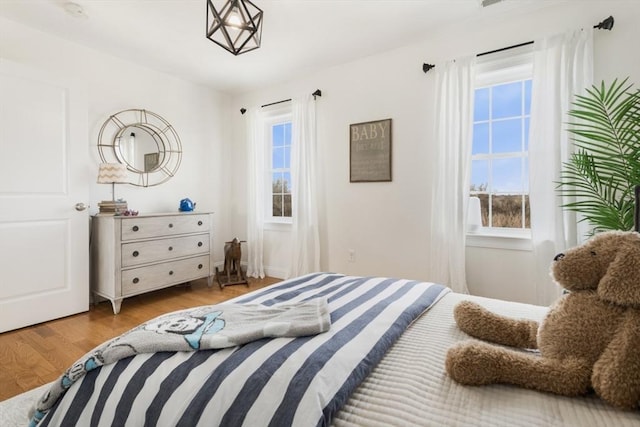 bedroom with wood finished floors