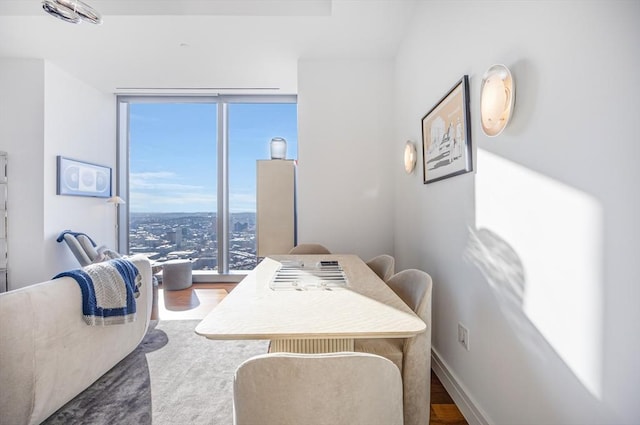 dining area with hardwood / wood-style flooring