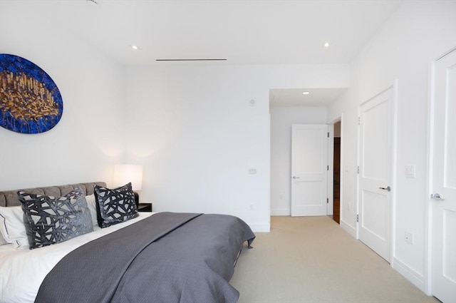 bedroom featuring light colored carpet