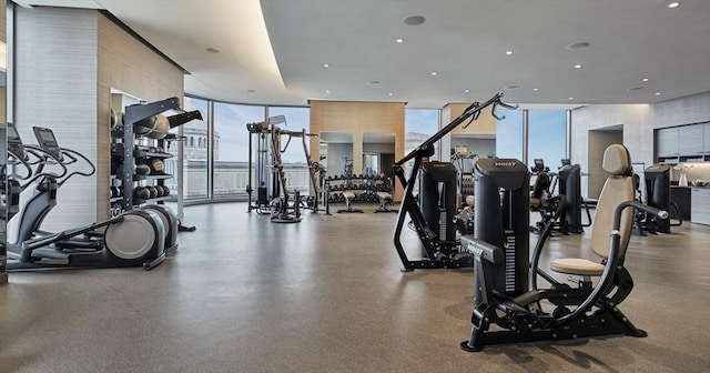 exercise room with floor to ceiling windows