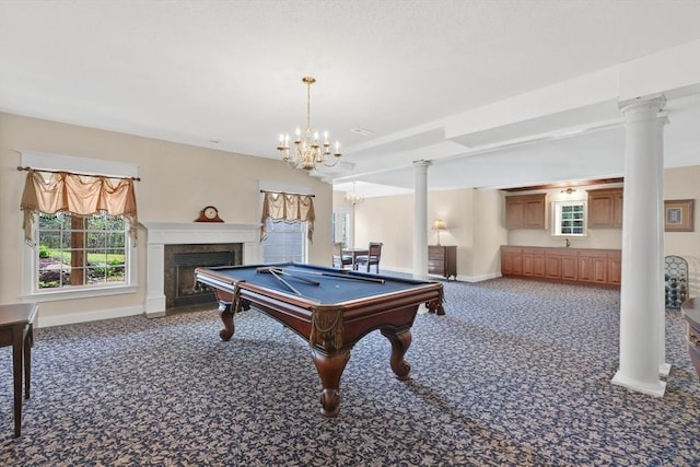 recreation room featuring carpet flooring, a notable chandelier, a fireplace, baseboards, and billiards