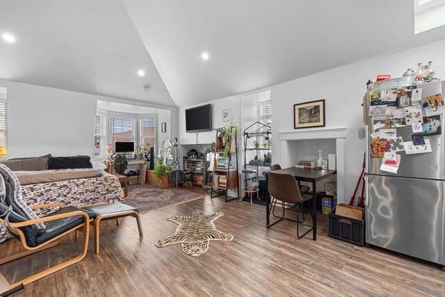 103-105 Broadway, Chelsea, MA 02150 - living room with wood finished floors, recessed lighting, and high vaulted ceiling