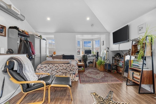 103-105 Broadway, Chelsea, MA 02150 - living room with lofted ceiling, wood finished floors, recessed lighting, and an office area