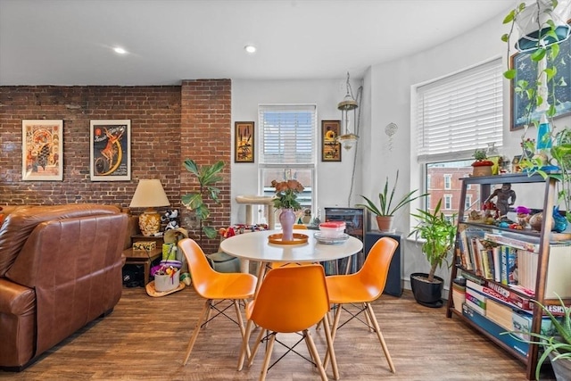 103-105 Broadway, Chelsea, MA 02150 - dining space featuring wood finished floors and brick wall