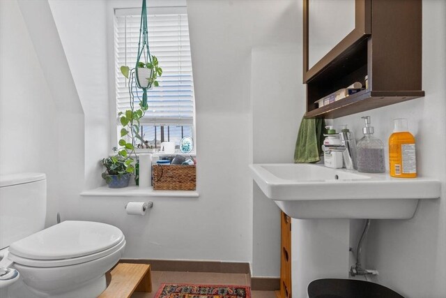 103-105 Broadway, Chelsea, MA 02150 - half bathroom with toilet and baseboards