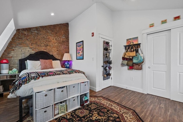 103-105 Broadway, Chelsea, MA 02150 - bedroom featuring lofted ceiling, wood finished floors, and baseboards