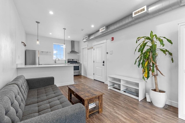 103-105 Broadway, Chelsea, MA 02150 - living room with dark wood finished floors and recessed lighting