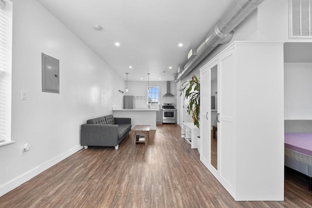 103-105 Broadway, Chelsea, MA 02150 - living room featuring electric panel, dark wood-style flooring, recessed lighting, and baseboards