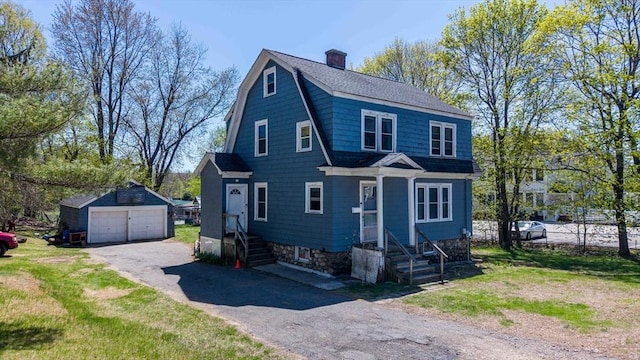 15 W St, Paxton, MA 01612 - dutch colonial featuring an outdoor structure, a garage, a gambrel roof, and a chimney