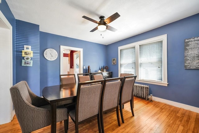 15 W St, Paxton, MA 01612 - dining area with radiator, a ceiling fan, and light wood-style floors