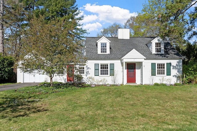 cape cod home with a shingled roof, a front lawn, a garage, a chimney, and driveway