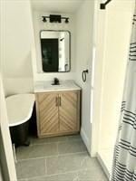 bathroom with vanity and tile patterned flooring