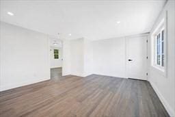 spare room with dark wood-type flooring