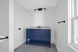 bathroom featuring a wealth of natural light and tile patterned floors