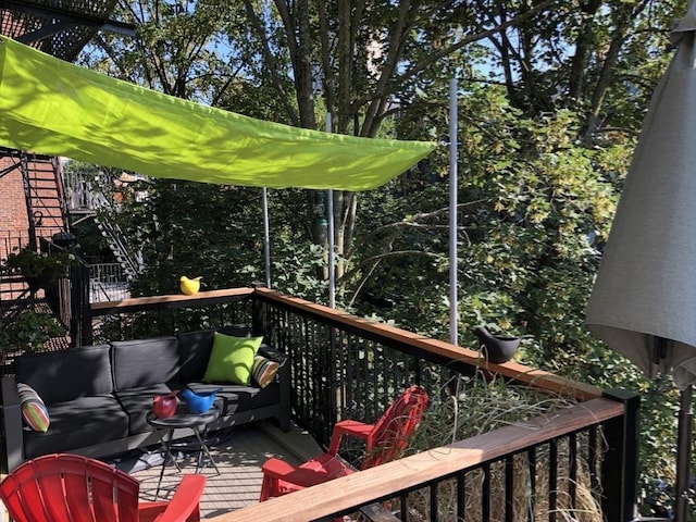 31 E Springfield St Unit 3, Boston, MA 02118 - wooden deck with outdoor lounge area