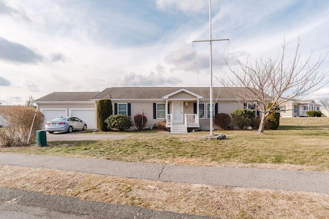 single story home featuring a garage and a front yard