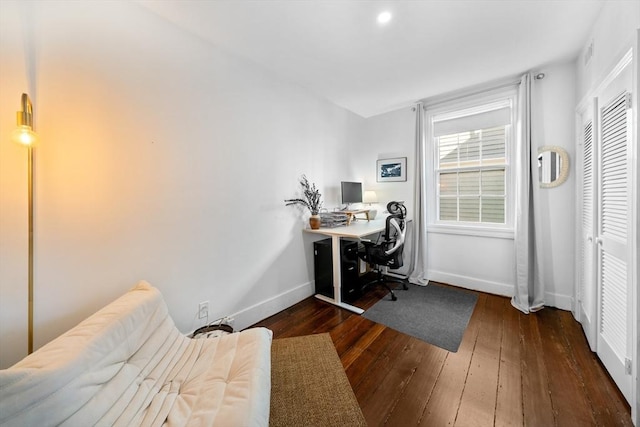office space featuring baseboards and dark wood finished floors
